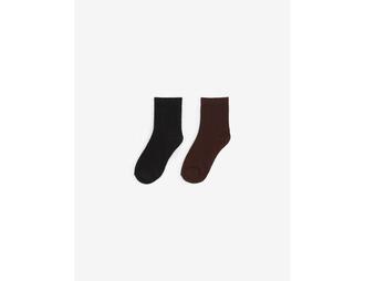 Chaussettes hautes blanc, marron, noir offre à 2,99 Dh sur Jennyfer