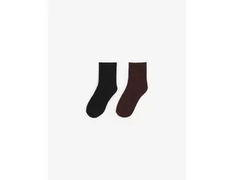 Chaussettes hautes blanc, marron, noir offre à 5,99 Dh sur Jennyfer